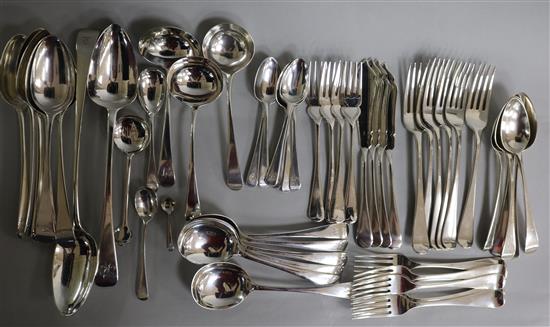 A fifty three piece service of mainly Georgian silver Old English pattern flatware for six including basting spoons,